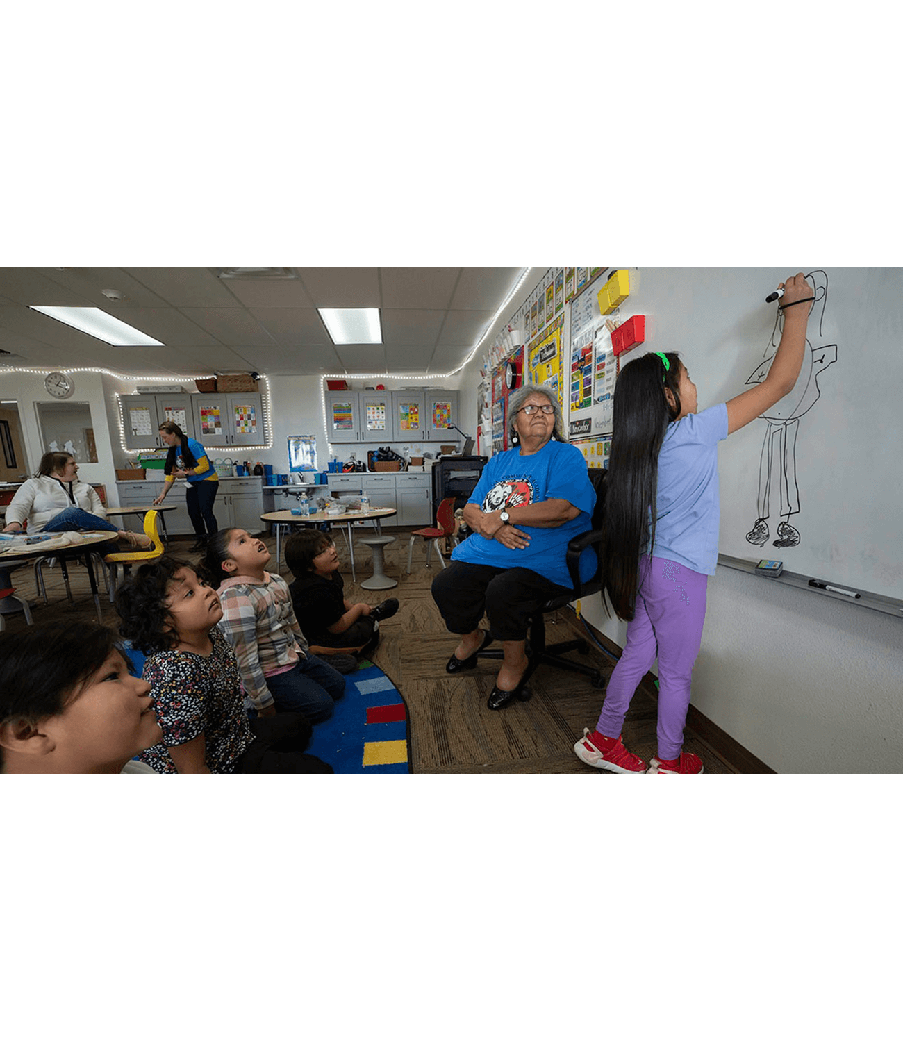 First-grade student RedSky Lang during a language game led by Betty Howe, Ute Mountain Ute tribal elder, Courtesy of The Colorado Trust, Photography by Shannon Mullane